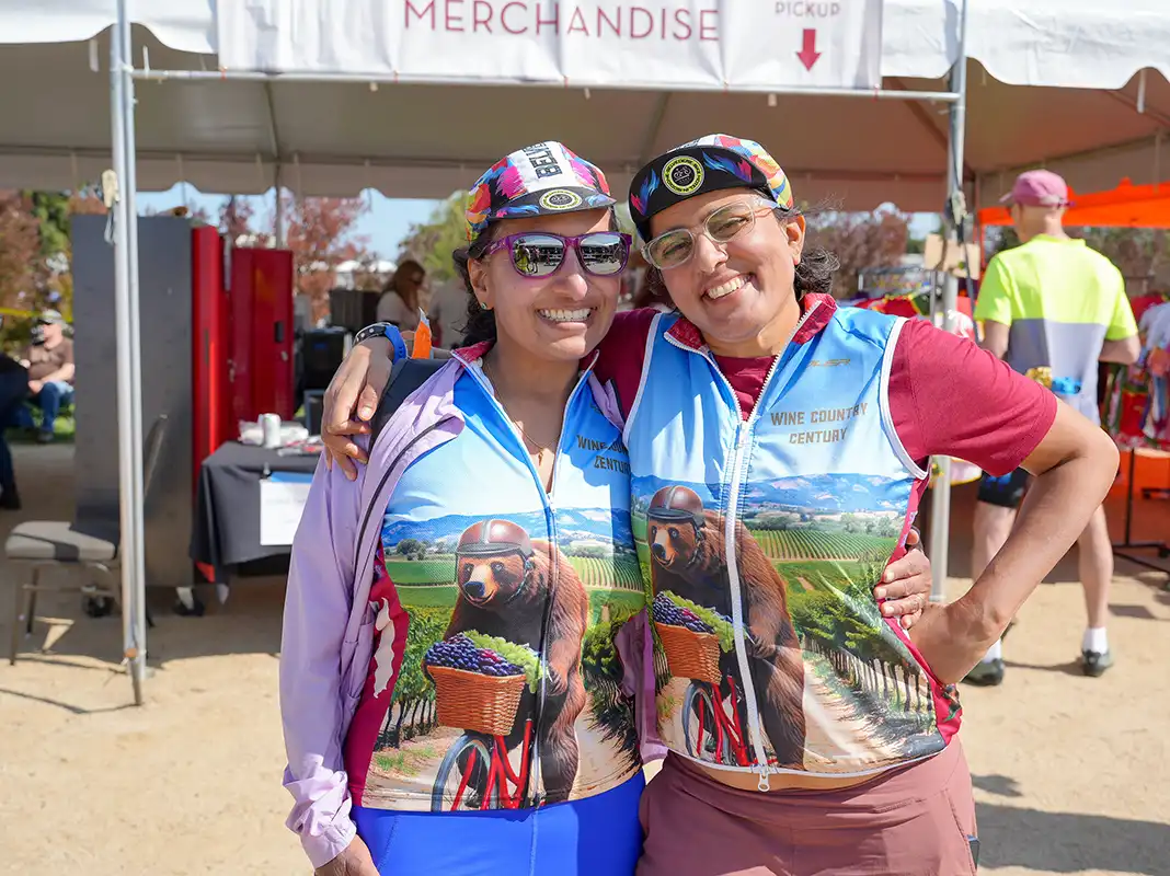 Two female cyclists posing